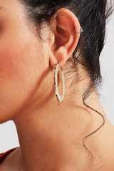 Curveins Sparkle Gem Circle Bridgitte Earrings featuring gold-tone frame and radiant gemstones for a chic and elegant look.