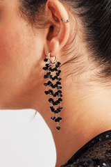 Curveins Black Fringe Earrings with cascading black beads and gold-tone hoop for bold elegance