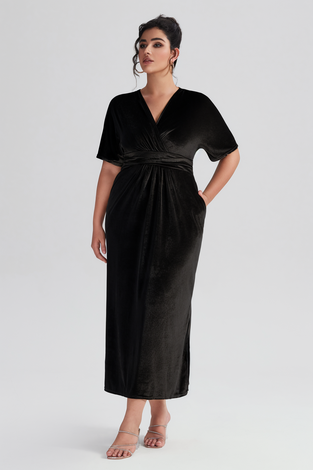 Curveins Plus Size Elegant Velvet V-Neck Shirred Maxi Dress in black, featuring a deep V-neckline, short sleeves, and a flattering shirred waist.