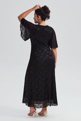 Back view of plus-size black lace maxi dress, highlighting the lace detailing and flowing maxi length, ideal for formal events