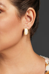 Close-up of gold-plated square curved hoop earrings with a glossy enamel inlay, perfect for weddings, cocktail parties, or everyday chic looks.