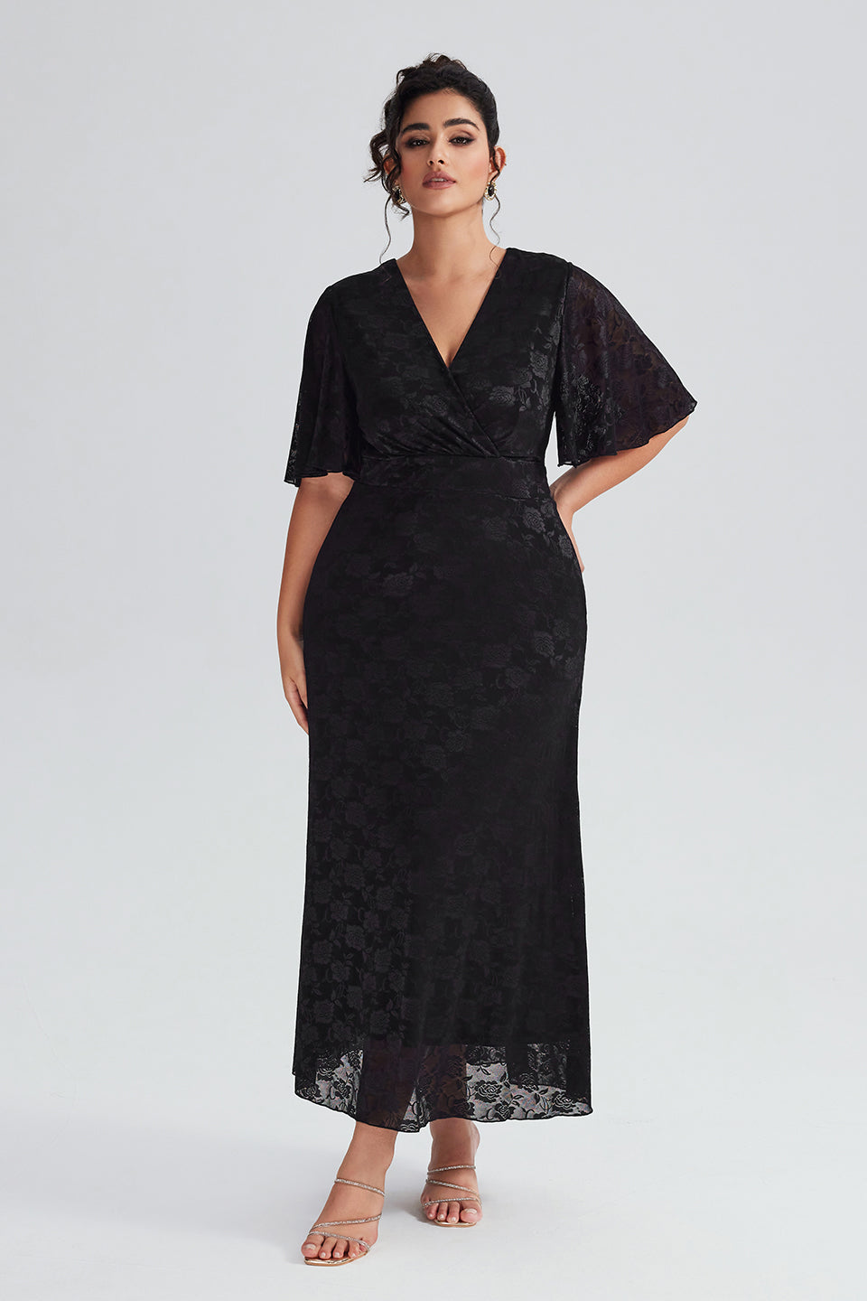 Front view of plus-size black lace maxi dress with flutter sleeves, perfect for evening wear and formal events