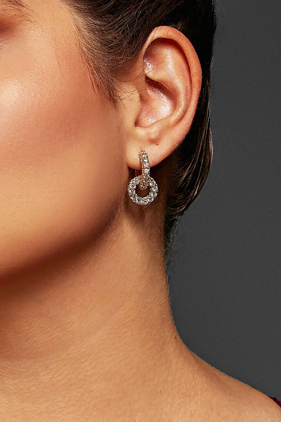 Gold-tone knot crystal earrings featuring sparkling crystal embellishments, perfect for plus size formal dresses, cocktail outfits, or casual glam.