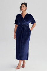 Curveins Plus Size Navy Blue V-Neck Velvet Maxi Dress with a relaxed fit and side slit, perfect for formal occasions.