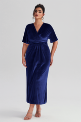 Curveins Plus Size Navy Blue V-Neck Velvet Maxi Dress with a cinched waist and luxurious velvet fabric, ideal for evening events.