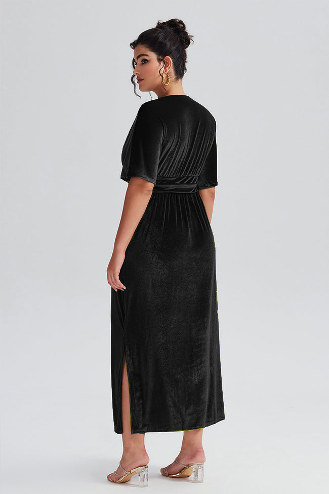 Back view of the Curveins Plus Size Elegant Velvet V-Neck Shirred Maxi Dress in black, showcasing a slit detail and soft velvet texture.